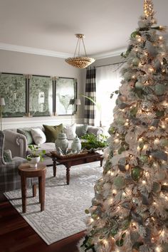 a white christmas tree in a living room