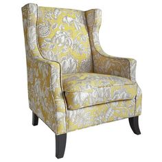 an upholstered chair with yellow and white floral fabric