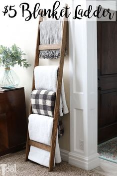 a wooden ladder with towels on it and the words $ 5 blanket ladder hero tool belt