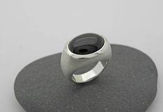 Elegant, simple silver ring with transversely aligned onyx in oval cabochon cut and beautiful dark black. Onyx oval 12 x 16mm All ring sizes are available. Please write your ring size in the comment field by checking out. On the following link, you will find the ring with a larger stone 20 x 15mm https://www.etsy.com/de/listing/228065410/grosser-onix-ring-in-silber-925?ref=shop_home_active_17 Modern Oval Cabochon Signet Ring For Formal Occasions, Minimalist Oval Cabochon Signet Ring For Formal, Minimalist Oval Cabochon Signet Ring For Formal Occasions, Formal Black Cabochon Signet Ring, Black Cabochon Signet Ring For Formal Occasions, Modern Oval Cabochon Signet Ring, Modern Domed Cabochon Rings, Modern Oval Cabochon Signet Ring As Gift, Modern Oval Cabochon Signet Ring For Gift