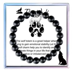 a black beaded bracelet with an image of a wolf on it