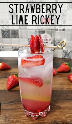 strawberry lime rickey in a glass with strawberries on the rim and text overlay that reads, strawberry lime rickey only 4 ingredients & takes 3 minutes