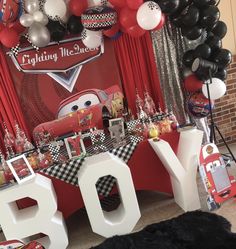 a birthday party with cars balloons and decorations