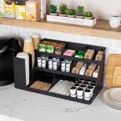 a kitchen counter with coffee cups and other items on it