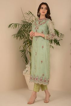 Make a statement choice by selecting our enchanted turqoise green silhoutte shirt which is well ensemble with contarst red color thread not embroidery on neck hem continued with botanical thread work along with kora, dabka, sequence and pearl work. Boti texture n all over shirt with heavy daman work. Bunch work on sleeves with jamawar straight pants and khadi net dupatta Shirt Fabric: Pure khadi Net Shirt Length: 45” Pant Fabric: Jamawar Dupatta Fabric: Net Shirt, Pant & dupatta color: Pale Turq Festive Green Kurta With Floral Embroidery, Designer Green Kurta For Spring, Green Straight Kurta With Floral Embroidery, Elegant Green Kurta With Floral Embroidery, Eid Kurta With Floral Embroidery In Green, Green Floral Embroidery Kurta For Eid, Green Floral Embroidered Kurta For Eid, Green Floral Embroidered Straight Kurta Set, Spring Green Traditional Wear With Dupatta