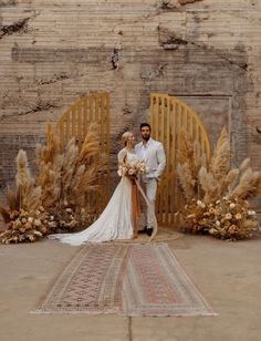 a bride standing in front of an archway