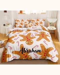 a bed with gingerbreads on it and the word abraham written in black ink