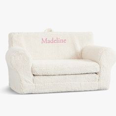 a white chair with the name madeline on it's back and pink lettering