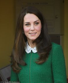 a woman wearing a green jacket and white shirt