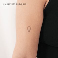 small ice cream cone tattoo on the right arm