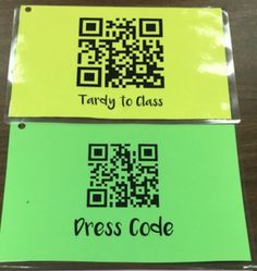 two yellow and green tags with qr code on them