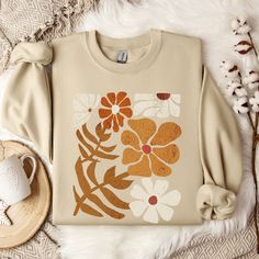 Boho Flower Fall Sweatshirt Graphic Sweatshirts Fall Sweatshirts Fall Sweater Fall Shirt Fall Shirts Boho Floral Shirt Wildflower Shirt Cottagecore Wildflower Sweatshirt This sweater is made from polyester and cotton. This combination helps designs come out looking fresh and beautiful.  The collar is ribbed knit, so it retains its shape even after washing.   Knit in one piece using tubular knit, it reduces fabric waste and makes the garment more attractive.  There are no itchy side seams on thes Wildflower Sweatshirt, Cricut Clothes, Asd Classroom, Flower Fall, Tee Ideas, Wildflower Shirt, Floral Sweatshirt, Fall Graphic, Sweatshirt Graphic