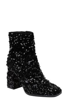 Paillettes catch the light from every angle on a richly textured boot featuring a cushioned footbed and dramatic block heel. 4" heel Synthetic upper/cotton lining/rubber sole Imported No Heel Boots, Sequin Boots, Black Cowboy Boots, Tour Outfits, Sequin Outfit, Flip Flop Slippers, Eras Tour, Black Sequins, Holiday Outfits