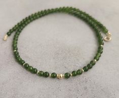 Green jade gemstone beaded chocker,every day necklace Made with smooth 4mm jade beads and 14k solid yellow gold beads and clasp. Please select your prefered length before checkout This minimalist necklace can be worn short as a chocker or longer alone or layered with other necklaces  Measures: 💚4mm  jade smooth beads 💚2mm and 4mm solid gold beads 💚6mm spring ring clasp 100% 14k solid gold hallmarked on clasp Elegant Jade Round Beads Jewelry, Elegant Jade Jewelry With Round Beads, Elegant Jade Beaded Jewelry, Elegant Jade Necklaces With Round Beads, Elegant Jade Jewelry With Spacer Beads, Spiritual Jewelry With Tiny Round Beads, Classic Jade Jewelry For May Birthstone, Jade Necklaces With Round Beads For Gifts, Jade Necklace With Round Beads For Gifts