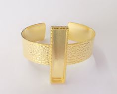 Material Wrist strap : Brass Blank : zinc alloy Color: Shiny Gold Wristband width: 20 mm Blank Size : 50x10 mm Square Blank inner depth : 3 mm Quantity : 1 pc. To see other all Gold Bracelet Blanks please click below https://www.etsy.com/shop/AZsupplies/search?search_query=bracelet+blank+gold&order=date_desc&view_type=list&ref=shop_search To see other all Silver Bracelet Blanks please click below https://www.etsy.com/shop/AZsupplies/search?search_query=bracelet+blank+silver&order Adjustable Gold Band Cuff Bracelet, Gold Nickel-free Round Cuff Bracelet, Metal Band Jewelry As Gift, Nickel-free Metal Cuff Bracelets, Gold Metal Cuff Bangle, Nickel-free Gold Metal Bangle, Adjustable Metal Bangle For Formal Occasions, Adjustable Gold Rectangular Cuff Bracelet, Gold Adjustable Rectangular Cuff Bracelet