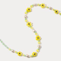 Sunshine around your neck! This delightful Pearl Yellow Flower Beaded Necklace features 18k gold-plated brass and blooms with sparkling crystals and soft yellow pearls. For the nature lover, this color stone necklace captures the beauty of a blooming garden in wearable form, serving as a constant reminder of the wonder and joy found in the natural world. The delicate pearls, sunny gemstones, and pops of vivid color stones come together to create a piece that is both visually stunning and deeply symbolic. DETAILS Plating: 18K Gold Materials: 18K Gold on Brass, Pearl, Natural Stone, Quartz, Crystal Measurements: Length: 16.14"(41cm) + Extender: 2.36"(6cm) Bead Size: 0.39"* 0.51 "(1.0cm*1.3cm) Weight: 19.1 g Yellow Flower Necklace For Summer, Summer Yellow Flower Necklaces, Summer Yellow Flower Necklace, Spring Jewelry With Colorful Beads In Gold, Spring Gold Jewelry With Colorful Beads, Spring Pearl Gold Jewelry, Spring Gold Pearl Jewelry, Summer Gold Jewelry With Flower Decoration, Yellow Pearl Beaded Necklaces As Gift