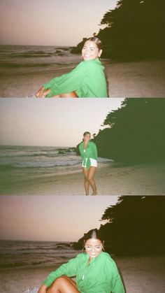 a woman sitting on top of a beach next to the ocean