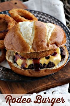 a chicken sandwich and onion rings on a plate