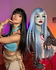 two mannequins dressed in costumes posing for the camera