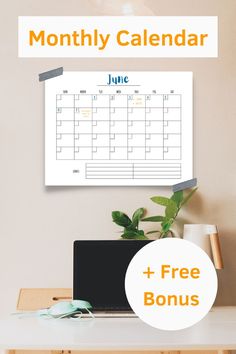 a desk with a laptop and a calendar on it