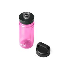 a pink water bottle next to a black lid