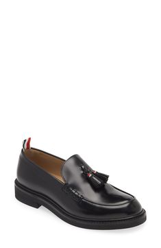 Subtle trim flashes the brand's signature colors on the heel tab and swingy tassels of this sleek Italian loafer crafted of burnished calfskin leather. Leather upper and lining/rubber sole Made in Italy Designer Shoes Formal Leather Tassel Loafers With Contrast Sole, Mens Tassel Loafers, Italian Loafers, Suede Tassel, Tassel Loafers, Thom Browne, Leather Loafers, Loafer Shoes, Loafers Men