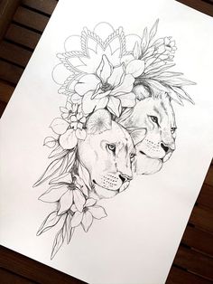 a drawing of two lions surrounded by flowers