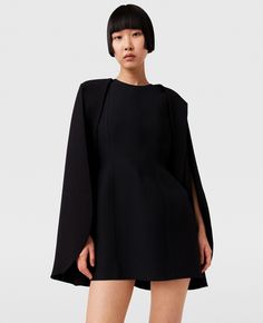 Women Pitch black Round Neck Cape Mini Dress | Stella McCartney US Black Dress With Structured Shoulders For Fall, Structured Mini Dress For Fall Evening, Structured Mini Dress For Evening In Fall, Modern Black Dresses For Work, Black Spring Dresses With Structured Shoulders, Spring Black Dresses With Structured Shoulders, Black Dresses With Structured Shoulders For Spring, Black Dress With Structured Shoulders For Work, Modern Black Mini Dress For Workwear