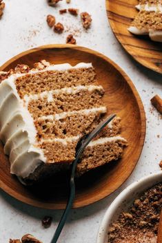 a slice of carrot cake on a plate with a fork