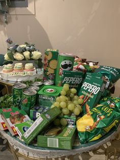 a table topped with lots of food and snacks