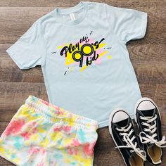 Play like a 90's kid - you know, more outside time and less screen time!  This shirt has a nostalgic 90's vibe.  Made from 100% ring-spun combed cotton, this classic youth jersey t-shirt is soft and comfy--great for an everyday outfit. If you want the family to match, you can find other sizes here! Toddler: https://www.etsy.com/QuietBookQueen/listing/1325308655/play-like-a-90s-kid-toddler-t-shirt Adult: https://www.etsy.com/QuietBookQUeen/listing/1325308987/play-like-a-90s-kid-adult-unisex-t-shirt * 100% ring-spun combed cotton * Soft jersey fabric * Fabric weight: 4.5 4.5 oz./sq. yd. (153 g/m²) * Crew neck and ribbed collar * Shoulder-to-shoulder taping * Double-needle stitched sleeves and bottom hem * Set-in sleeves * Blank product sourced from India, Mexico, Haiti, or Guatemala This pro 90s Inspired Blue T-shirt With Letter Print, 90s Inspired T-shirt For Summer Fan Merchandise, 90s Inspired Fan Merchandise T-shirt For Summer, 90s Inspired Pre-shrunk Summer T-shirt, 90s Inspired Summer T-shirt With Funny Print, 90s Style Summer T-shirt With Sublimation Print, Unisex 90s Style T-shirt For Summer, 90s Style Pre-shrunk T-shirt For Summer, 90s Inspired Funny Print T-shirt For Spring