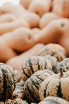 several pumpkins are stacked on top of each other