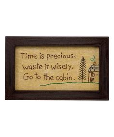 a wooden frame with a quote on it that says time is precious waste it wisely go to the cabin