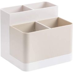 a white box with three compartments on the inside and two in the outside, sitting next to each other