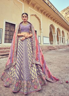 Woven zari Banarasi silk lehenga choli in Lavender 6010 Desc:  Style : A-Line Lehenga Choli Color : Lavender Fabric : Silk   Work : Heavy Jacquard Woven With Embroidery & Stone Work Wash Care : Dry clean Sleeve Style : Half Sleeve Long Sleeves : Done only in Custom Stitch Sleeves Lining : Done only in Custom Stitch Bust Size : 32 to 42 Inches Occasion : Wedding   Mehendi   Sangeet   Engagement   Reception   Ceremonial   Baby ShowerShop Banarasi lehenga,silk lehengas,heavy bridal le Luxury Cotton Silk Lehenga With Zari Weaving, Luxury Zari Weaving Lehenga For Traditional Ceremonies, Luxury Handloom Jamawar Lehenga, Luxury Handloom Lehenga For Eid, Luxury Lehenga With Zari Weaving For Traditional Ceremonies, Luxury Banarasi Silk Lehenga For Eid, Luxury Traditional Banarasi Silk Choli, Luxury Katan Silk Lehenga For Festive Season, Cheap Wedding Lehenga With Zari Weaving