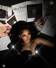 an image of a woman in black dress surrounded by papers