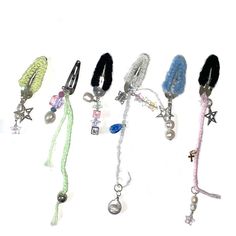 six different colored lanyards with charms and beads