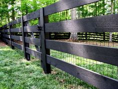 a black fence with metal bars on it