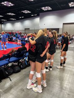 the volleyball team huddle together before their match