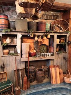 an old fashioned kitchen with lots of pots and pans