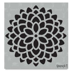 the stencil flower design is shown in black and white, on a gray background