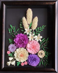 an image of flowers that are in a frame