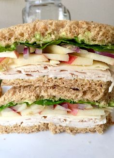 a cut in half sandwich sitting on top of a white plate