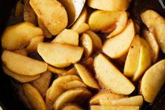 sliced apples are cooking in a pan on the stove top, ready to be cooked