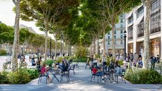 an artist's impression of people sitting at tables in the middle of a park