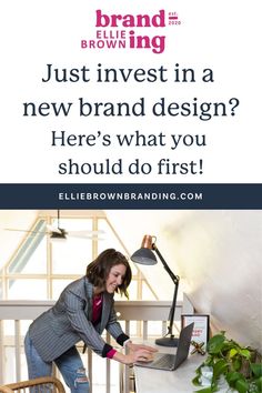 a woman is working on her laptop while standing in front of a desk with the words, just invest in a new brand design here's what you should do first