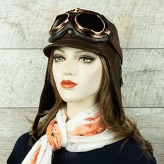 Aviator hat made of genuine leather, chestnut brown, for women. Unisex hat Embrace the spirit of adventure in style with our chestnut aviator cap. Add up some fabulous aviator goggles and you're sure to turn heads while being protected from the elements. This aviator hat is made from high quality and durable materials including genuine soft leather with a beautiful grain finish. Antique brass snaps and buckles on the straps provide a comfortable fit under the chin and on the back with a retro to Vintage Brown Travel Hat, Brown Retro Hat For Outdoor, Steampunk Brown Brimmed Hats, Steampunk Brown Adjustable Hat, Steampunk Style Brown Brimmed Hat, Brown Steampunk Brimmed Hats, Brown Steampunk Hat With Short Brim, Adjustable Brown Hat For Adventure, Fur Hat Men