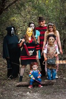 a group of people in costumes posing for a photo