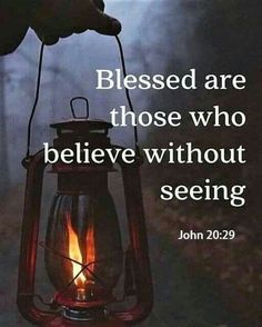 a person holding a lantern with the words, blessed are those who believe without seeing