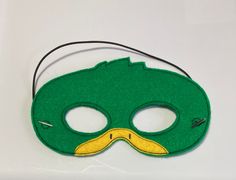 "Mallard Duck Masks. Great for dramatic play/dress-up. Fun mask for Halloween or Cos Play. These masks would make a fun party favor or fun addition to a themed birthday party. Need a larger quantity than what I have listed? Message me. I can usually accommodate larger orders. These masks are made from felt. The details are machine embroidered. The masks include a 13\" elastic strap. This size typically fits from age 3 to small adult. This mask measures approximately 7 by 4 inches. These items ca Green Halloween Costume Party Mask, Halloween Themed Party Masks And Prosthetics, Themed Eye Mask For Costume Party, Themed Mask For Carnival Costume Party, Themed Masks For Costume Party And Carnival, Themed Mask For Costume Party And Carnival, Green Masks For Carnival Costume Party, Themed Carnival Costume Accessories Mask, Themed Party Eye Mask Costume Accessory